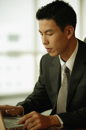 Young man using laptopの写真素材