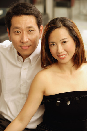 Well dressed couple looking at camera, portraitの写真素材