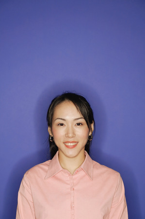Young woman, looking at camera, smilingの写真素材