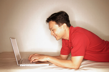 Man using laptop, profileの写真素材