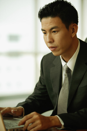 Young man using laptopの写真素材