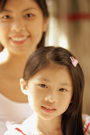 Mother and daughter, looking at cameraの写真素材