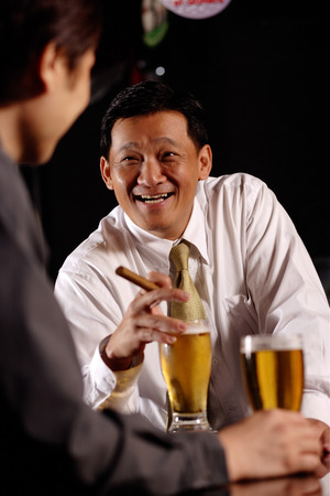 Two men drinking beer.の写真素材