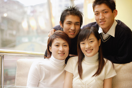 Young adults posing, looking at cameraの写真素材