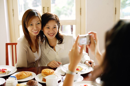 Women posing for photographの写真素材