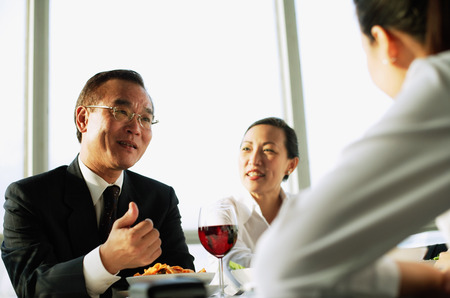 Executives having lunch meeting, low angle viewの写真素材
