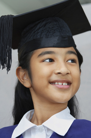girl resting chin on folded handsの写真素材