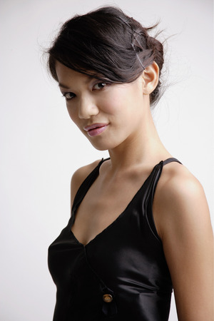 Young woman looking at camera, portraitの写真素材