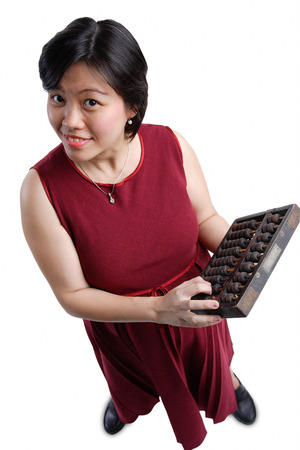 Woman looking at camera, holding abacusの写真素材