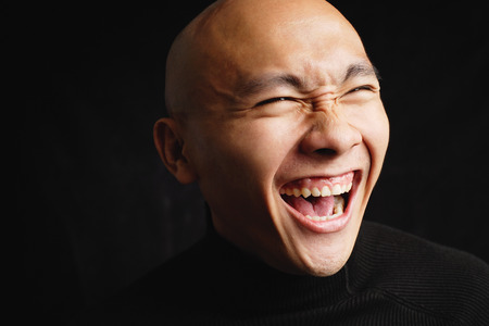 Bald man, laughing, portraitの写真素材