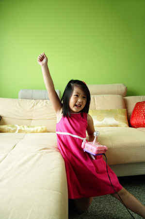 Girl playing video gamesの写真素材