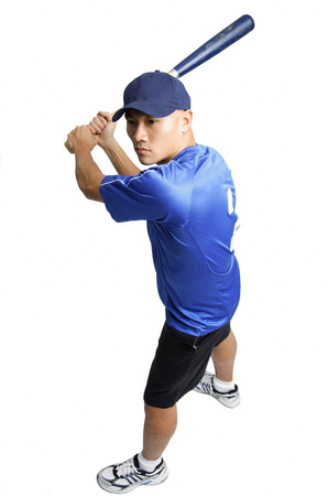 Young man holding baseball bat, preparing to swing