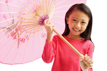 Girl holding pink umbrellaの写真素材