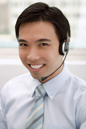 Businessman with headset onの写真素材