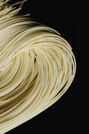 Chinese noodles against black background, close upの写真素材