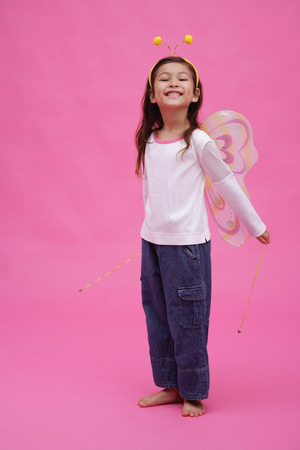 Young girl wearing fairy wings and deely bopperの写真素材