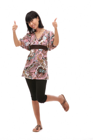Young woman making thumbs up signの写真素材
