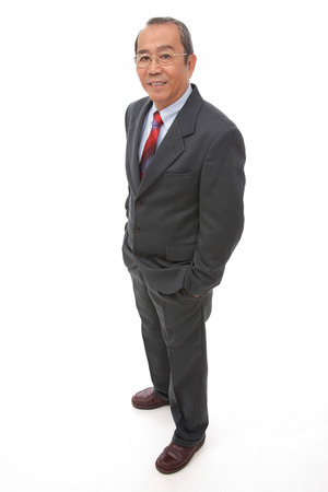 Businessman standing with hands in pocketの写真素材
