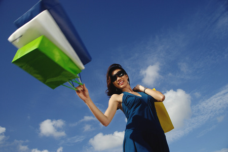 A young woman with shopping bagsの写真素材