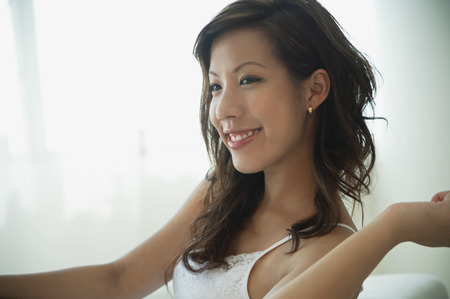 Young woman relaxing in living roomの写真素材