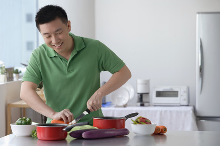 Man cooking in the kitchenの写真素材