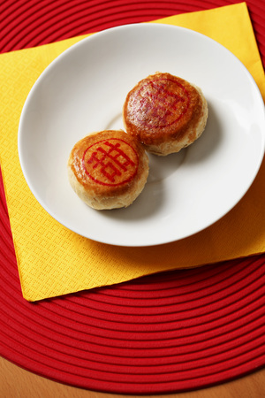 Chinese bean paste pastry. Chinese word for 'sweet' on top.の写真素材