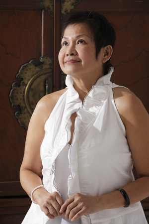 Mature Chinese woman looking upの写真素材