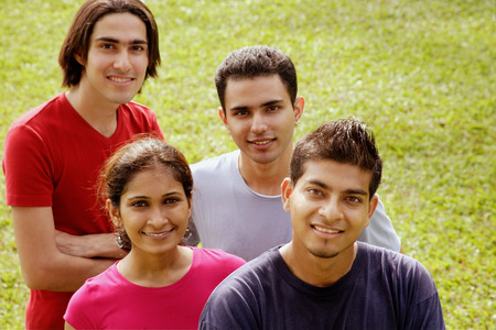 Young adults looking at camera, smilingの写真素材