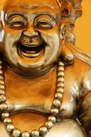 Bronze statue of Happy Buddhaの写真素材