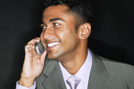Businessman mobile phone, smilingの写真素材