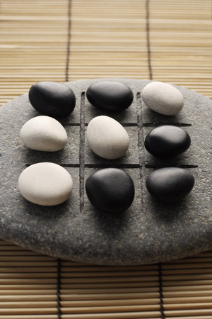 black and white pebbles on zen stoneの写真素材