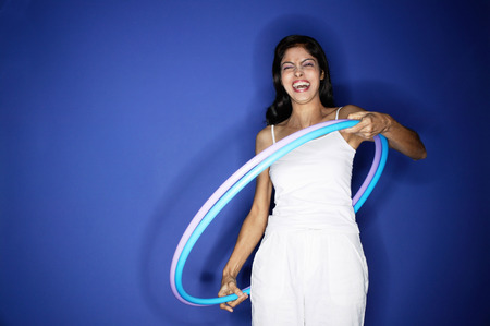 Woman with hoola hoopの写真素材