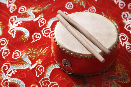 Still life of Chinese drum on Chinese silk fabricの写真素材