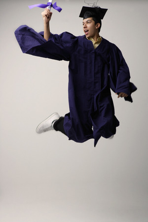 Graduate jumping for joyの写真素材