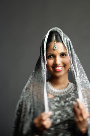 Woman in gray sari looking at camera, portrait