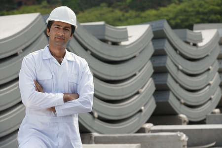 Man in work uniform arms crossed, looking at cameraの写真素材