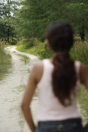 Young woman looking into distanceの写真素材