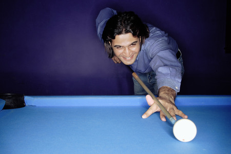 Man shooting pool