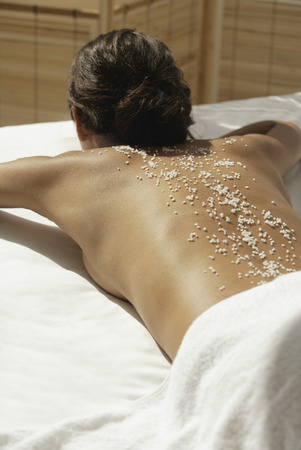 A woman relaxes at a spaの写真素材