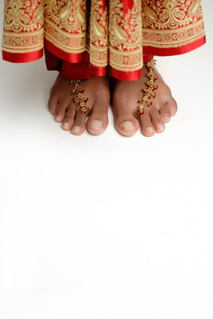 Woman's feet standing on white floorの写真素材