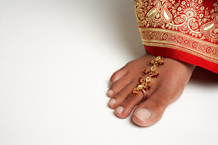 Close-up of woman's feet with traditional Indian toe ringの写真素材
