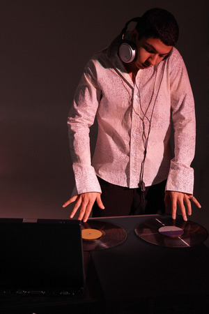 Young man working as DJの写真素材
