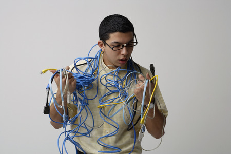Man with cords and wires around his neckの写真素材