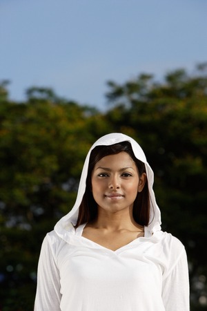 woman wearing hooded sweaterの写真素材