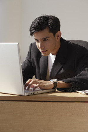 A man works on a laptopの写真素材