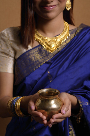 Indian woman holding offeringの写真素材