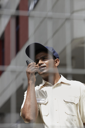 Security guard talking on walkie talkie