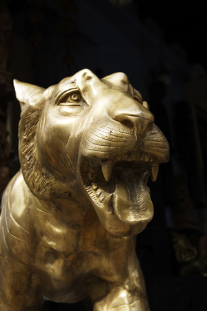Closeup of bronze tiger head in Little India, Singaporeの写真素材