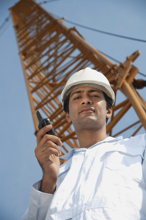 Man in work uniform looking downの写真素材