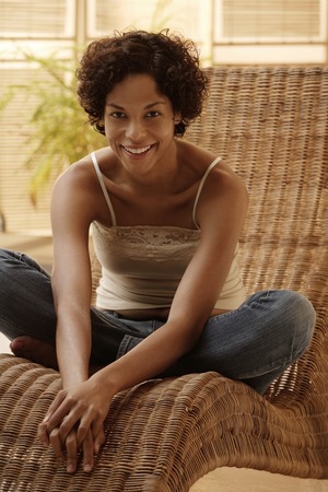 woman relaxing at home and smiling.の写真素材